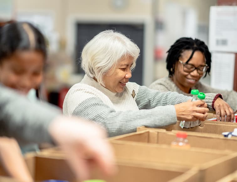 Bankuet food distribution warehouse with volunteers organizing supplies
